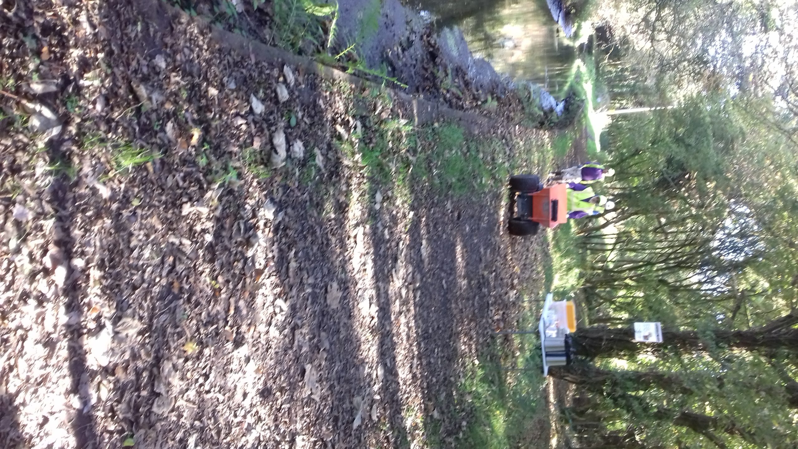 THE LONG HAUL DOWN THE TOWPATH. JOHN AT THE HELM OFF THE DUMPER TRUCK